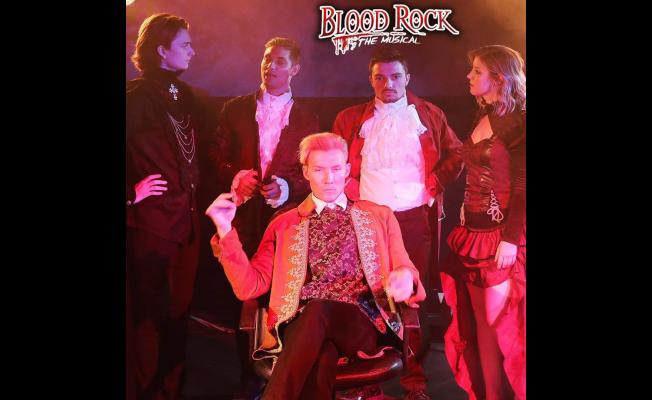 "Blood Rock: The Musical" Includes Cast Members Ethan Daniel Corbett, Seated, Bradley Cusack, Second from Left, and Ellie Wyman, Far Right