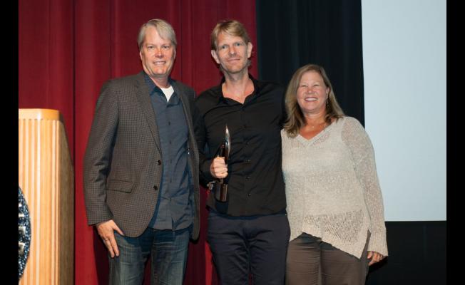 Left to Right, Randy Wachtler, Warner/Chappell Production Music, Gregor Narholz Accepting Award on Behalf of His Father Gerhard, and Elisabeth Oei, Sonoton Director, North America