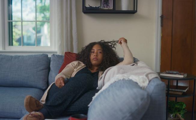 Wife Mia makes a short commute along the couch in one spot