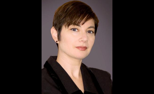 Janice Markham stars as the frumpy, determined, and always cheery, “Laura”