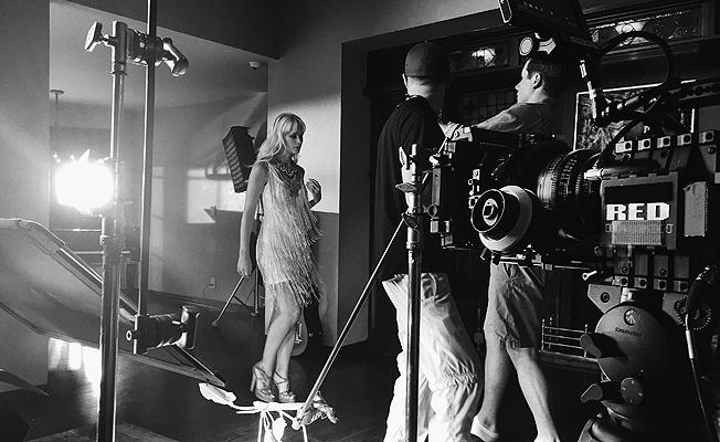RUNNER-UP SHOOT SUMMER 2016 BTS PHOTO CONTEST:The Red Dragon awaits its turn as co-director, Andrew Fairbank and DP Jacob Abrams catch the magic on set with model Lauren Bennette for Devonne by Demi Lovato. This Runner-Up image was shot using an iPhone 6 in Tarzana, CA. Photo credit: Gerrad Wilson
